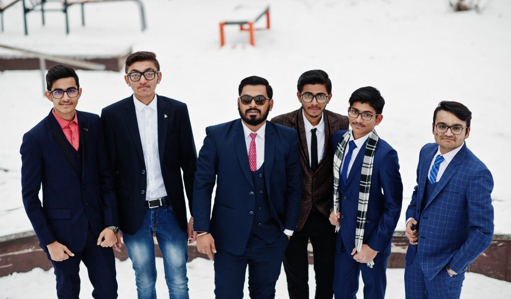 Group of six indian businessman in suits posed outdoor in winter day at Europe.